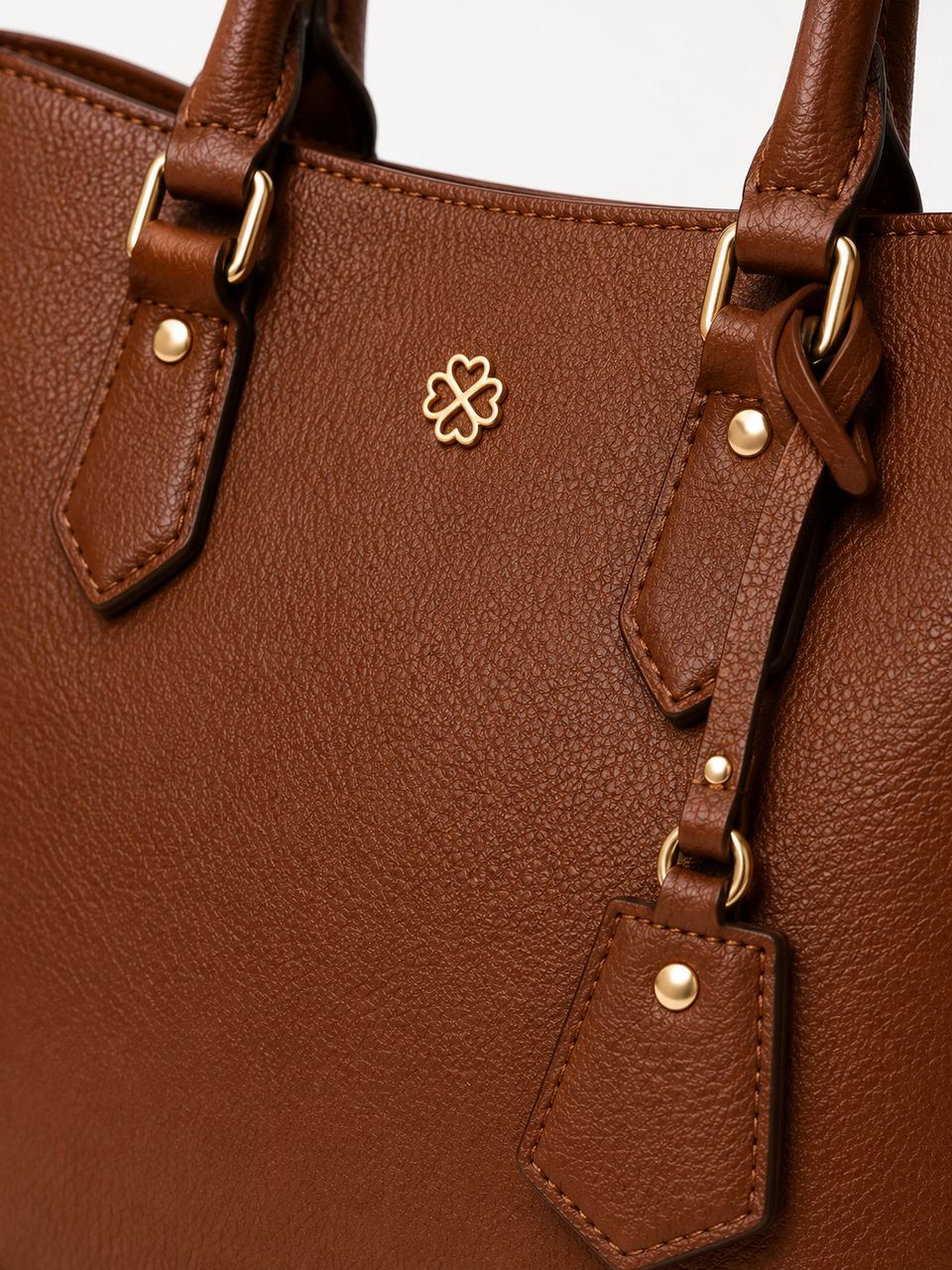 Close-up of the tote's leather grain and hardware